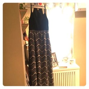 Racer back dress, mid-side slit in skirt.